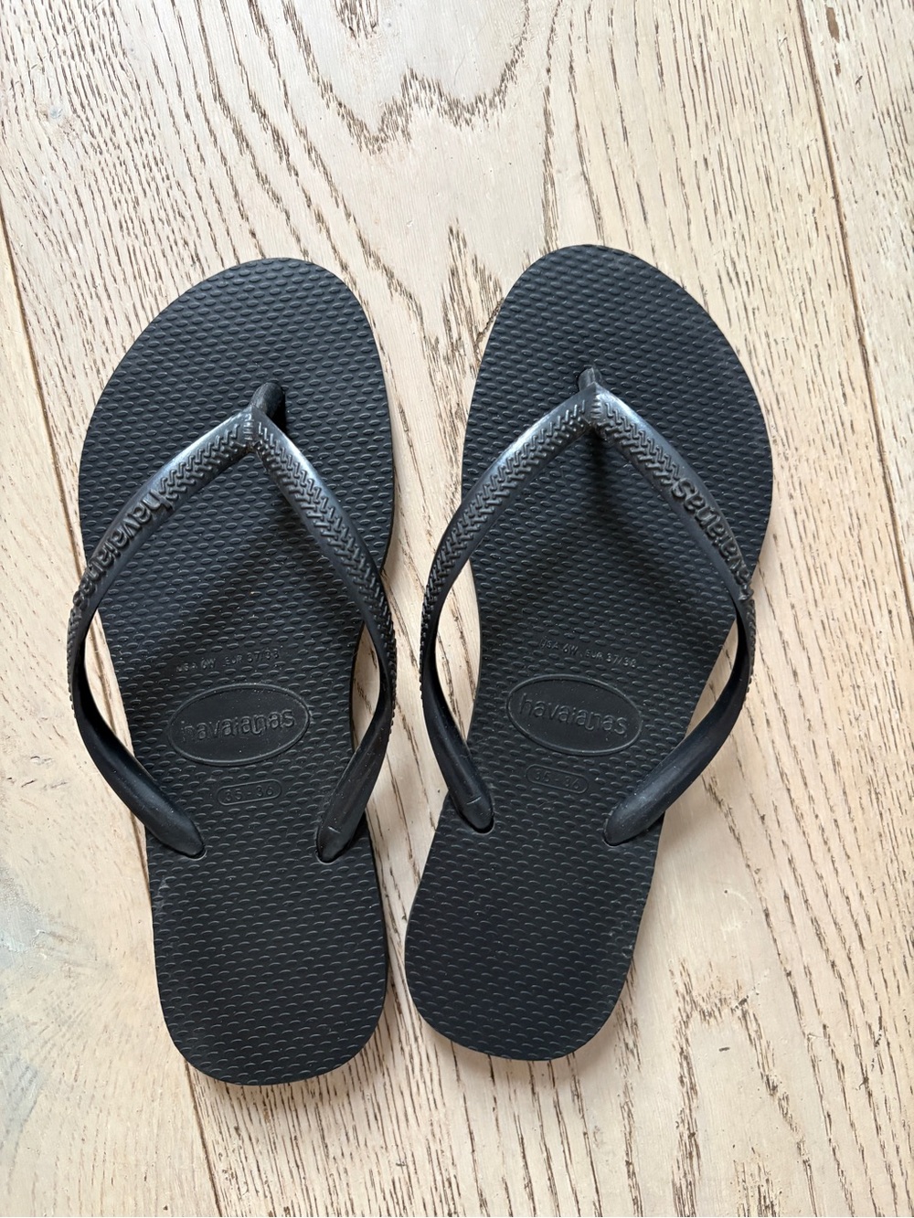 Havainas black flip flops